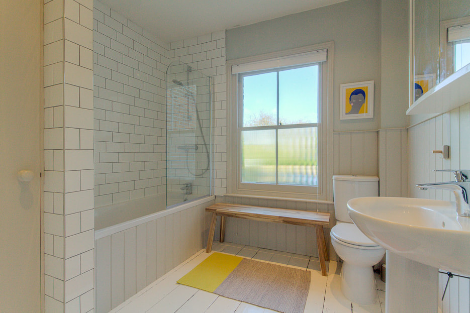Family bathroom with painted floors and tongue and groove